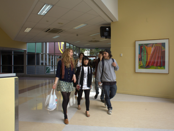 High school students walking through foyer