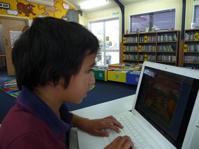 A student touch typing on a laptop