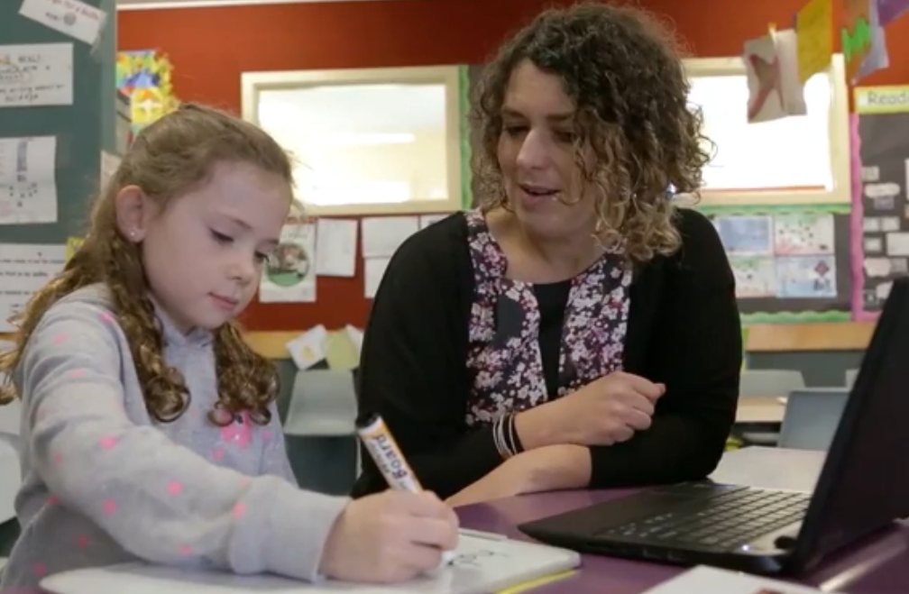 Teacher working with a student