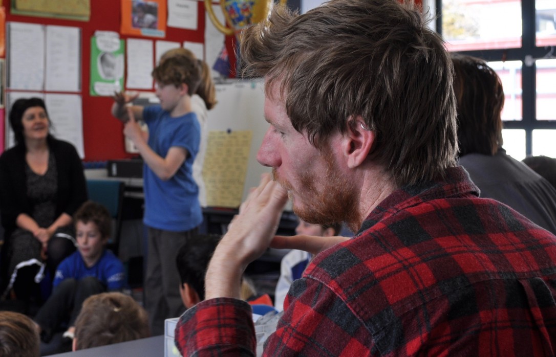 A teacher aide learns NZSL along with students
